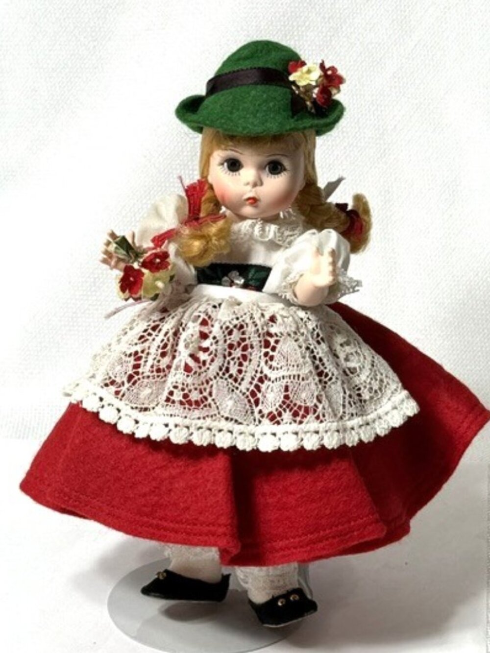 Madame Alexander restrung 8" Switzerland doll with stand.